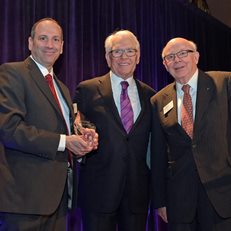 David Cowen and MoAF Chairman Dick Sylla present Charles Schwab with the 2016 Financial Innovation Award