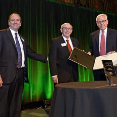 David Cowen and MoAF Chairman Dick Sylla present David Rubenstein with the 2015 Whitehead Award