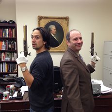 Lin-Manuel Miranda and David Cowen with replica pistols from the Hamilton/Burr duel