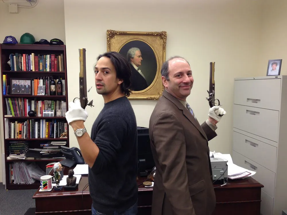 Lin-Manuel Miranda and David Cowen with replica pistols from the Hamilton/Burr duel