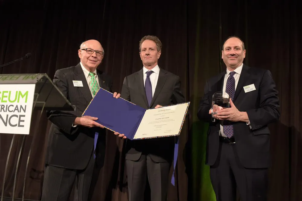 David Cowen and MoAF Chairman Dick Sylla present Tim Geithner with the 2018 Whitehead Award