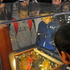Students check out the 18 karat gold Monopoly set, on loan from the National Museum of Natural History. Photo courtesy of Elsa Ruiz.