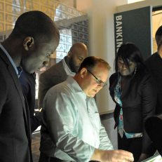 NFL players tour the Money: A History exhibit. Photo courtesy of Elsa Ruiz.